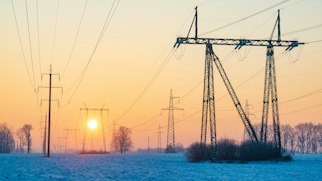 Photo depicts the Ukraine electricity grid in winter time. Power line pylons in cold winter morning. Illustration of blackout risk in Ukraine